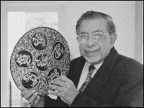 Gulam Musa with the symbol of the Shia Muslim sect 
