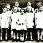 Picture of the girls on VE Day, from left to right, are Back Row — Carol Fletcher, Ettie Newton, Barbara Storey, and Gillian Radford. Front Row — Mary Hunt, Lillian Newton, Jean Ashley, Hilary Wignell, and Sylvia Bend in front.
