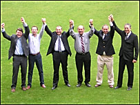 Consortium members celebrating their aquisition