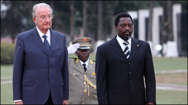 Belgium's King Albert II and Congolese President Joseph Kabila listen to national anthems during the king's arrival at the Palais des Nations in Kinshasa, Democratic Republic of Congo, on Monday, June 28, 2010