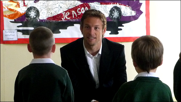 Jenson Button answering questions from children at a primary school in Frome, his home town