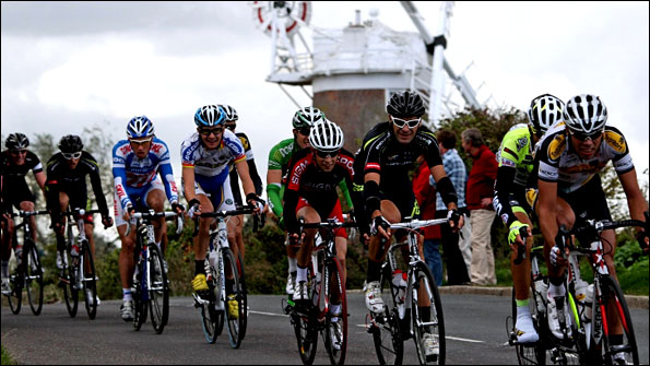 Tour of Britain riders pass through Cley in Norfolk
