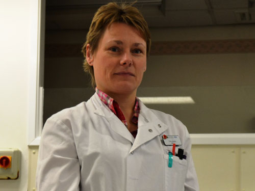 Lisa Jones 39 year old deaf mortician in lab coat 