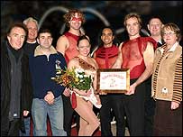 The Bull Dancers pick up their award.