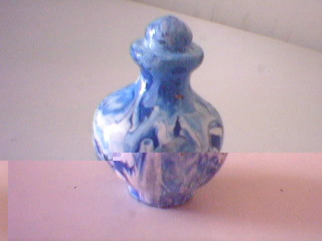 I painted this little pot with a finger.