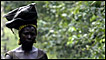 A Nigerian woman walks along oil pipeline