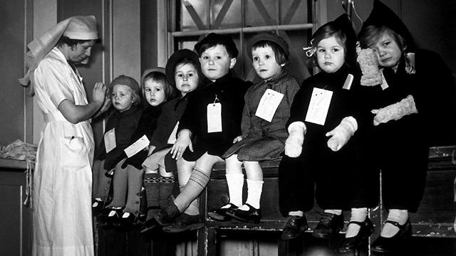 Very young evacuees prepare to travel, circa 1940. The experience was not always the exciting and jolly one that contemporary propaganda portrayed.