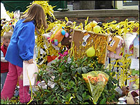 Tying yellow ribbons to the railings in Rothley