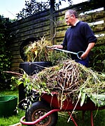 Man composting in garden