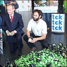 Activists present UN climate convention chief Yvo de Boer with alarm clocks symbolising the short time to Copenhagen