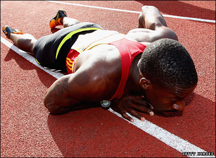 Chambers lies down on the track after his win