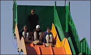 Picture: 3 boys ride the giant slide.