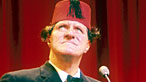Photograph of Tommy Cooper wearing his trademark fez