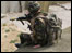 A soldier leaps over a wall