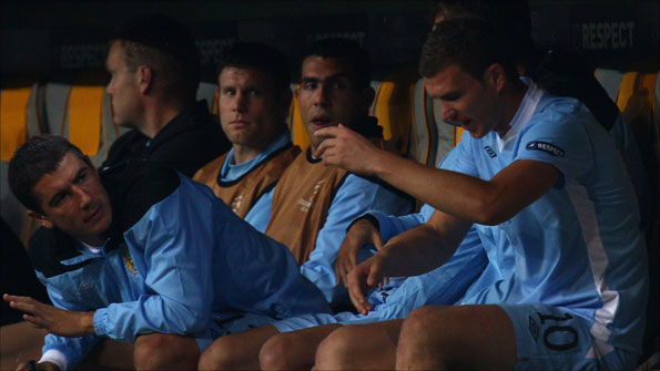 Carlos Tevez (centre) and the Manchester City substitutes at the Allianz Arena
