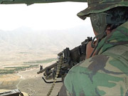 Soliders keep watch over the city from the Kabul Gates observation pos