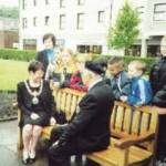 Mr Jim Jolly, Secretary of Branch No 51 (West Cumbria) of the Normandy Veterans Association talks to the Mayor of Copeland Mrs Joan Hully and primary school children from Whitehaven about the Normandy Memorial Seat. (St Nicholas Church Gardens, Whitehaven, Cumbria, 6 June 2000) Mr Jim Jolly, Secretary of Branch No 51 (West Cumbria) of the Normandy Veterans Association talks to the Mayor of Copeland Mrs Joan Hully and primary school children from Whitehaven about the Normandy Memorial Seat. (St Nicholas Church Gardens, Whitehaven, Cumbria, 6 June 2000)