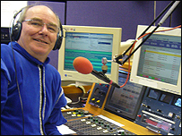 ray at radio desk in tudor costume