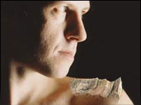 A man with a wood chip on his shoulder