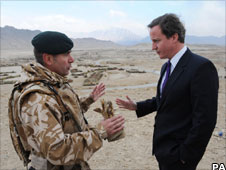 David Cameron talking to army officer in Afghanistan