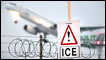 An ice warning sign at Heathrow airport as a plane takes off behind