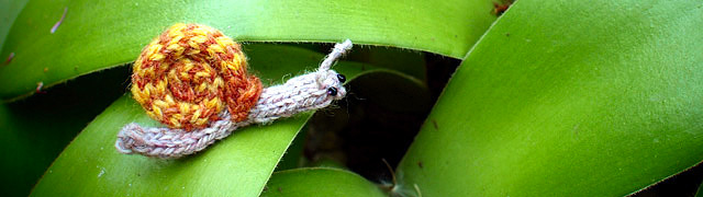 Small woollen snail on a leaf
