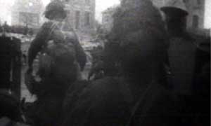 Troops disembark from the D-Day landing craft