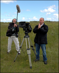BBC camera crew at ground level praying while Chris is parachuting to the ground