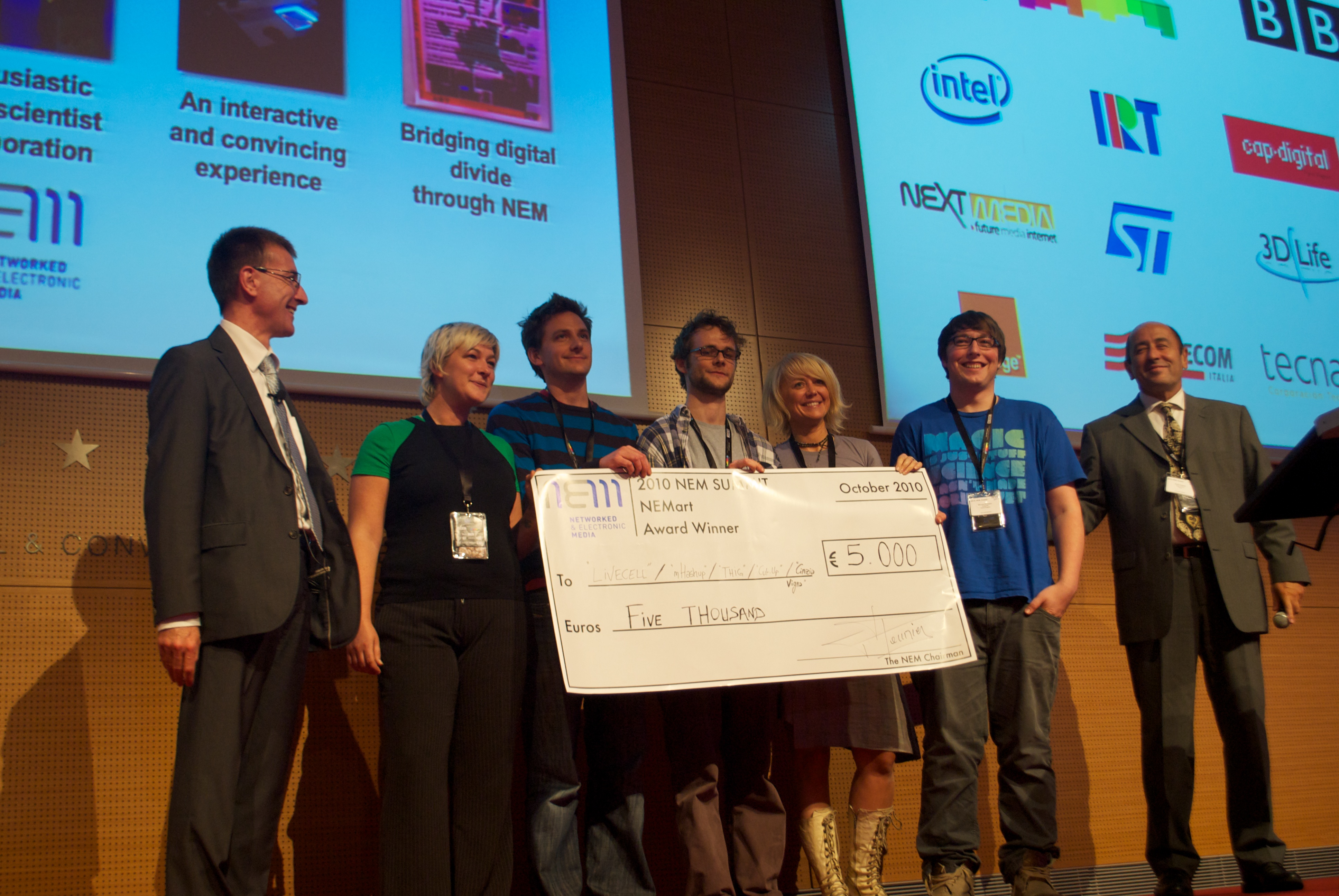 Chris Pike receives the award on behalf of the Cut-up