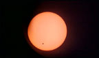 The black dot of Venus passing over the sun.