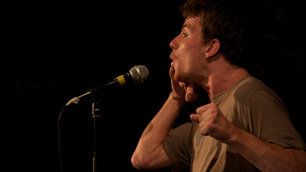 Ted Shiress performing at a comedy gig