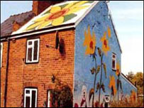 Sunflowers on side of artists house in Stevenage.