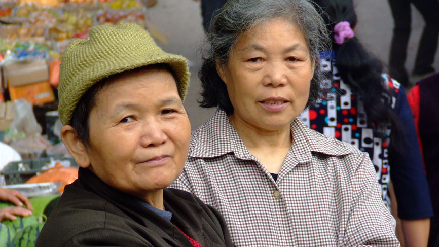 A Two elderly women at a market - Bei Bei.