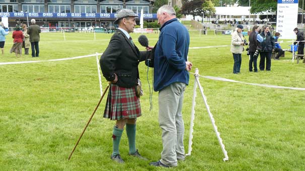 BBC Scotland presenter Mark Stephen interviewing Scott McGregor who had travelled from Australia to judge a Highland pony category.