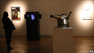 Woman watching art exhibition