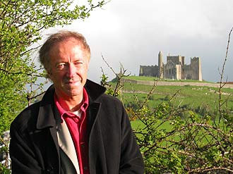 Presenter Mike Thomson with Cashel Cathedral behind him.