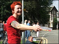 Victoria Hill hands sweets out to runners