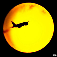 Sun with aeroplane