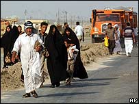 População deixando a cidade de Diwaniya