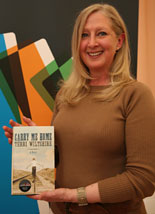Terri Wiltshire with her novel Carry Me Home, pictured at the longlist announcement in April © Academi
