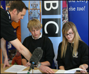 Budding reporters prepare to read the news