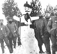 A group of German soldiers around a Christmas snowman