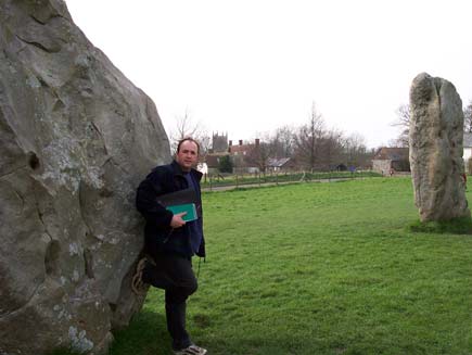 William Dalrymple, presenting The Long Search, stands at Avebury stone circle, ancient standing stones in the heart of the green Wiltshire countryside