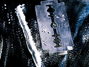 Lines of cocaine and razor blade