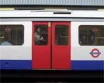 A tube train standing at a station platform
