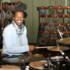 Ras can't resist a go on the drums
