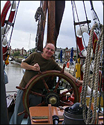 Ray at the wheel of Thames sailing barge