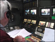 A mysterious figure directs our Outside Broadcast from the BBC van