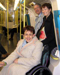 Tanni on a Jubilee Line tube train, with Dr Bob Price (Chair of the European Paralympic Committee) and Alison Nimmo from London 2012 in the background