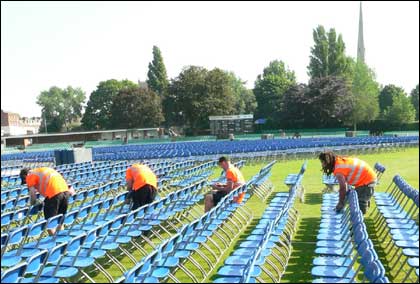 Putting out chairs for Elton John gig at New Road